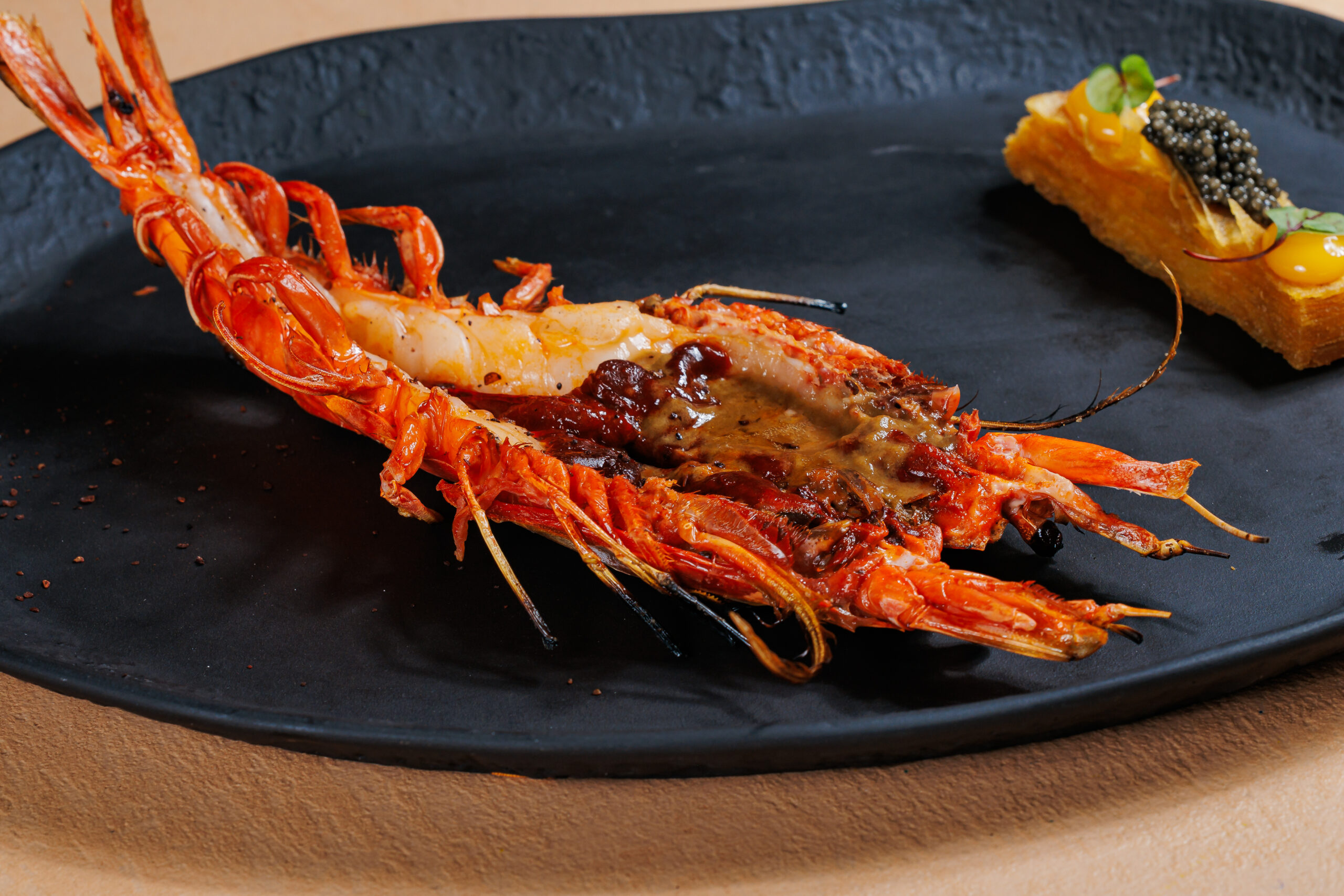 XXL scarlet prawn with potato millefeuille and caviar