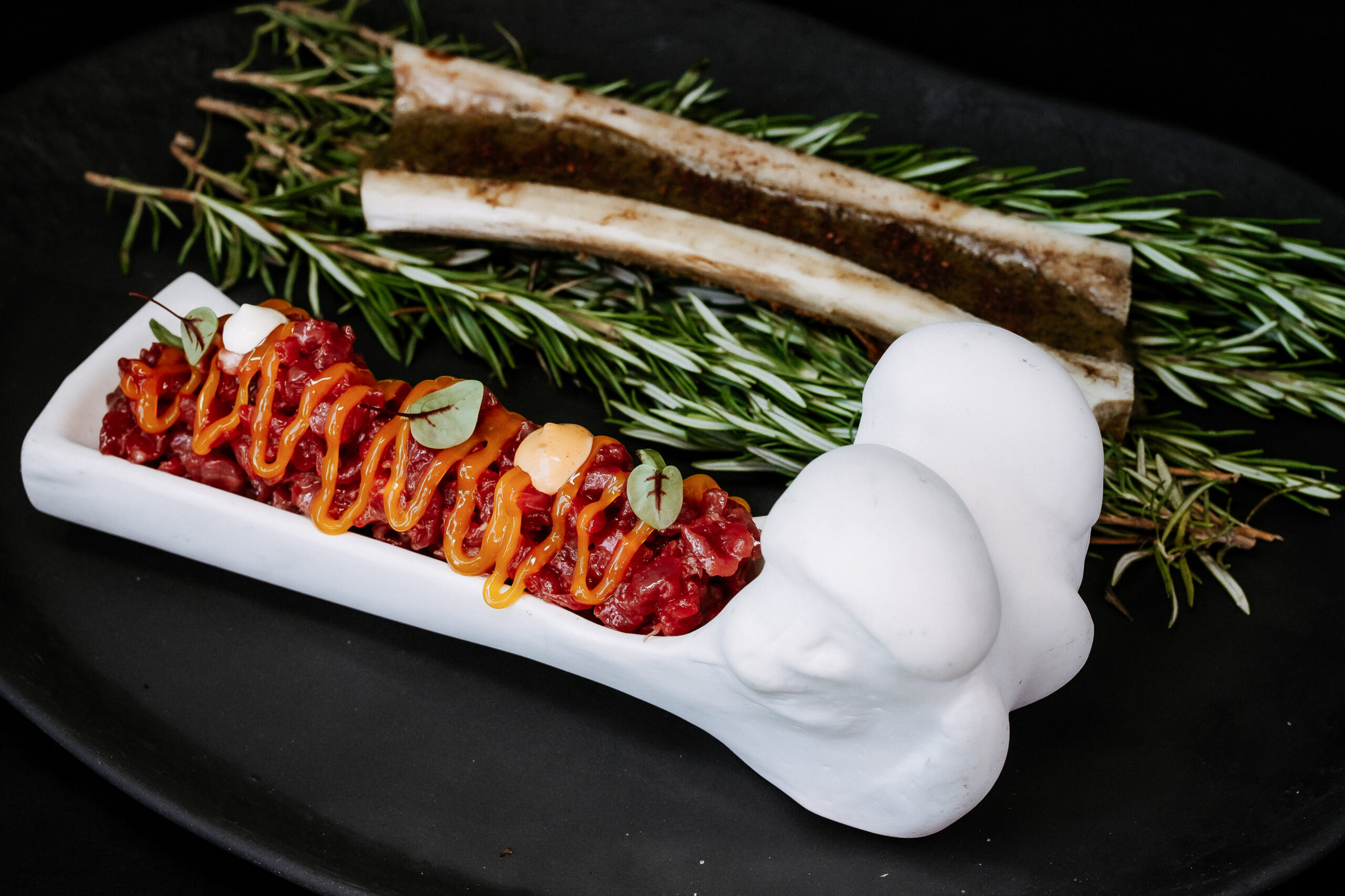 Beef tartare on grilled bone marrow H