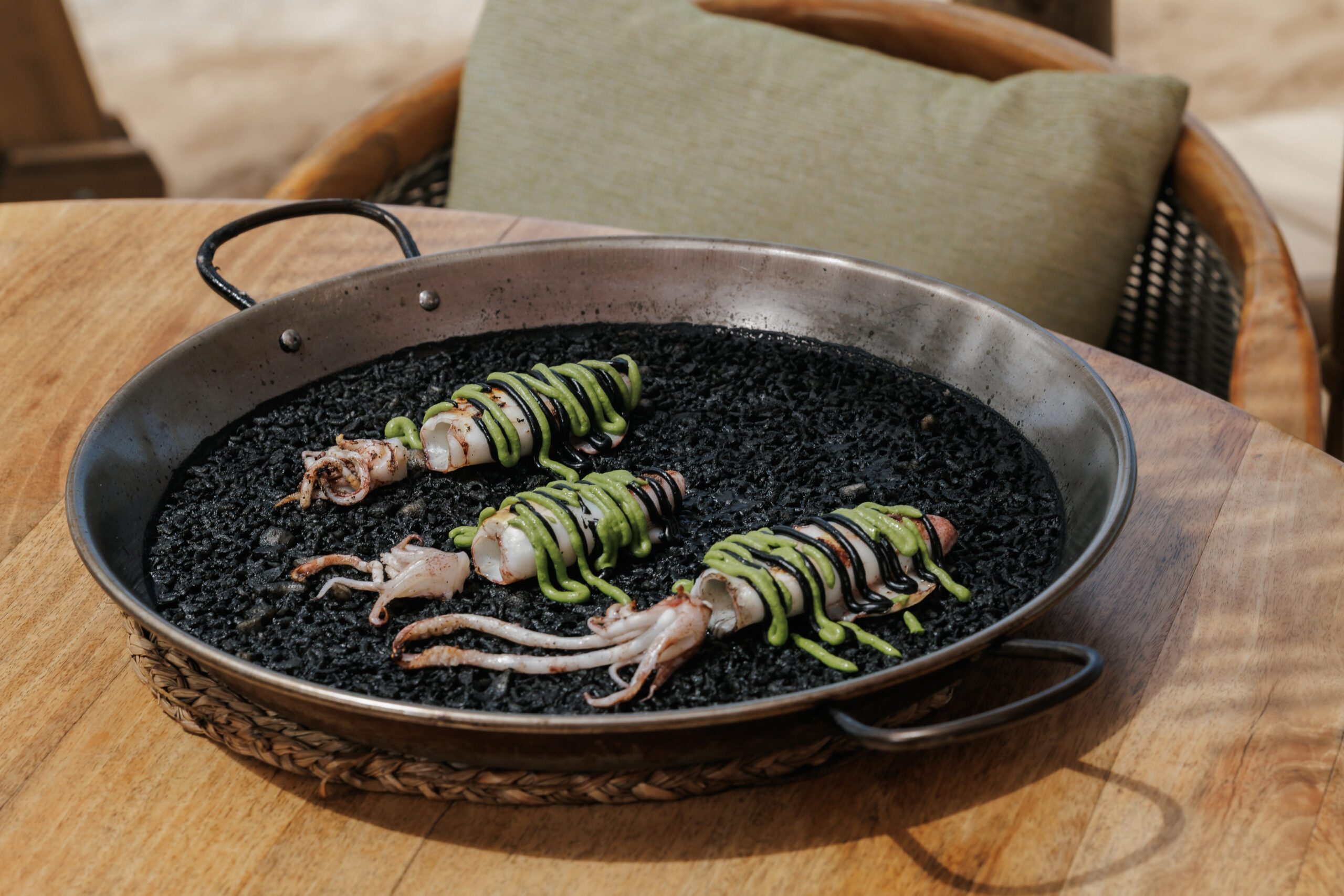 Black rice with grilled baby squid