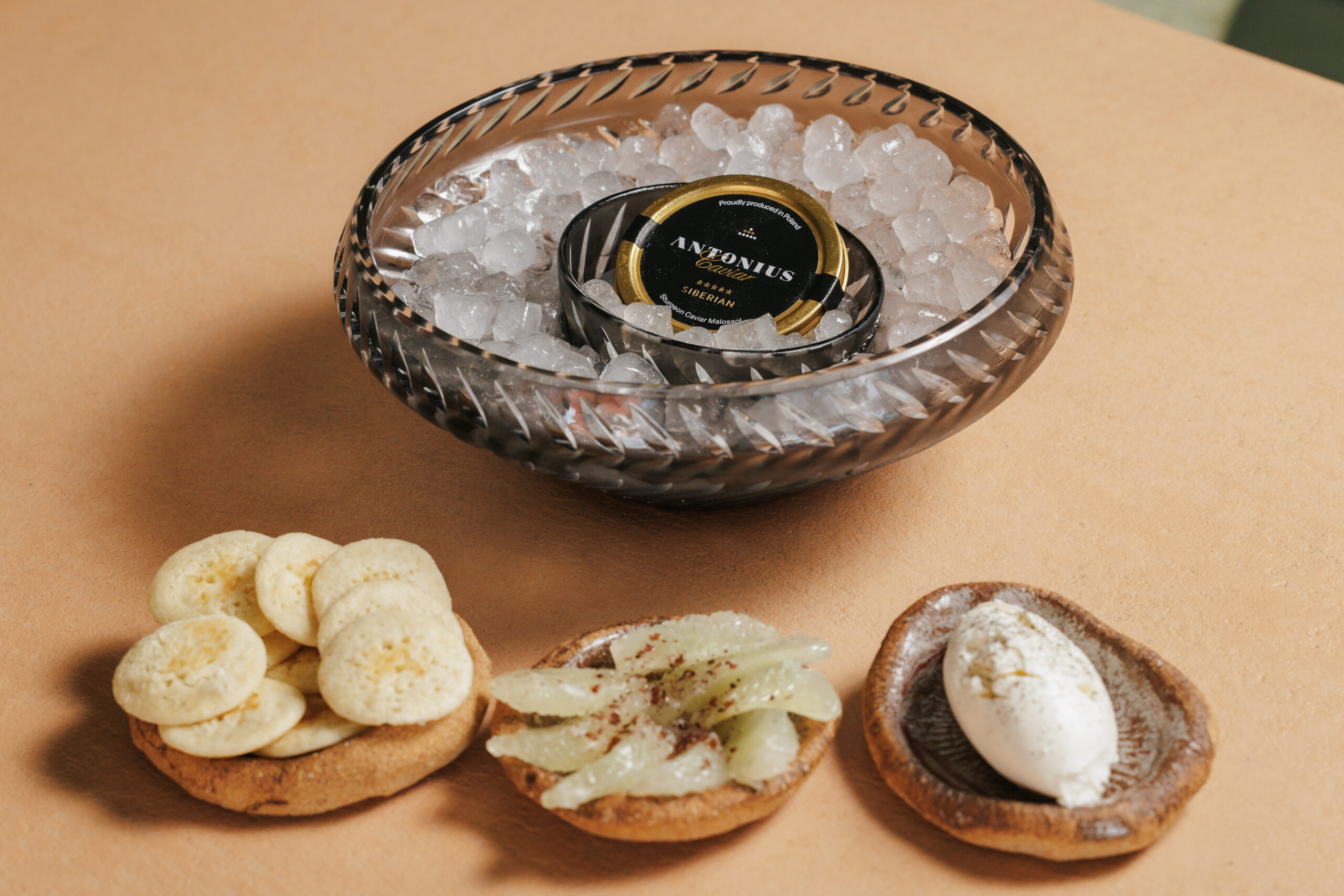30 g Caviar — served with blinis, sour cream and lime